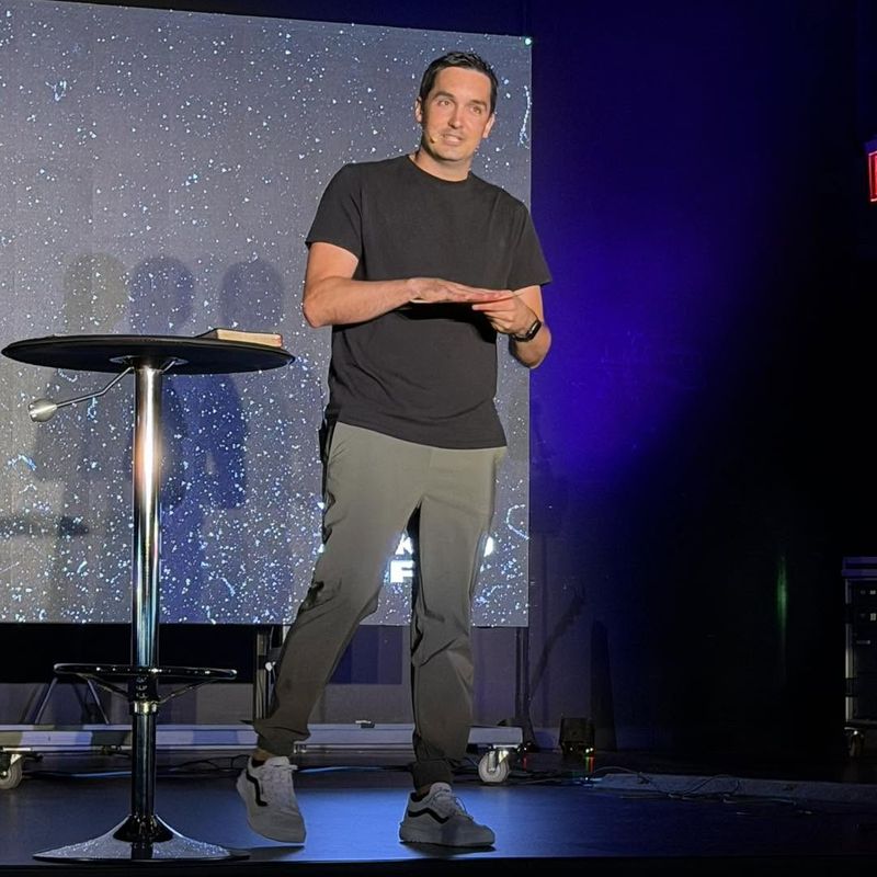A pastor preaching the Sunday message at Refuge Church