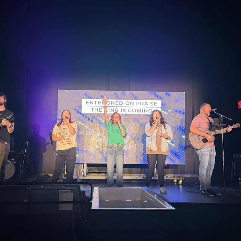 The Refuge Church worship team leading songs on stage